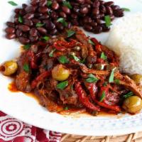 Barbacoa Dinner · Slow cooked Chile beef served with rice, beans, cilantro, onion, and tortillas.
