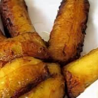 Platanos Fritos Con Frijol, Crema Y Queso Duro · Fried plantains served with beans, Salvadoran cream, and hard cheese.