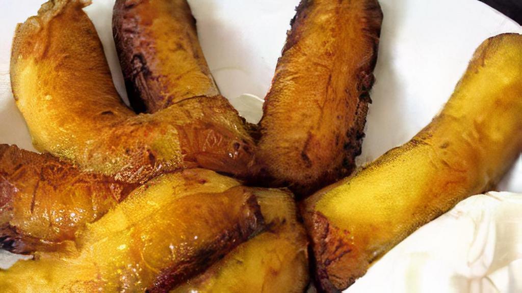 Platanos Fritos Con Frijol, Crema Y Queso Duro · Fried plantains served with beans, Salvadoran cream, and hard cheese.