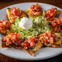 Holy Grail Nachos · ground beef or chicken on bean and cheese nachos, jalapeno, guacamole, sour cream