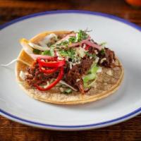 Short Rib Tacos · 3 tacos served with rice and beans. cabbage, fresno chilies, pickled red onion, cotija chees...
