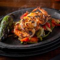 Shrimp Fajitas · chile garlic marinade, served with rice and beans, guacamole, roasted onions and peppers, fl...