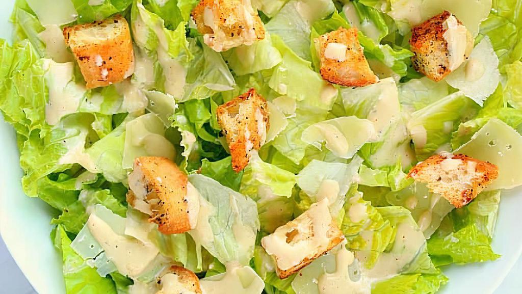 Caesar · Romaine lettuce, parmesan cheese and croutons.