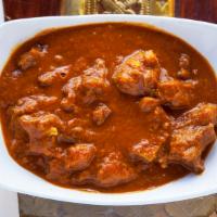 Goat Curry · Goat curry with herbs & spices in gravy sauce.
