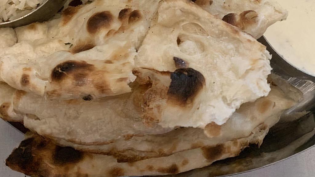 Plain Naan · Plain unleavened bread made in Tandoor.