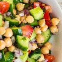 Iraqi Salad (Regular) · Cucumbers, tomatoes, onions, parsley, chickpeas, beets, lemon juice, and olive oil.