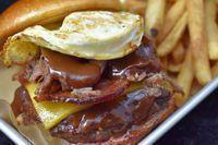 Hazy Sunrize · Short ribs, BBQ, fried egg, cheddar cheese, bacon

Served on a butter grilled bun with truff...