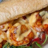 Shrimp Po Boy · French roll, garlic aioli, red onion, roasted red pepper, pepper jack cheese, bronzed Argent...