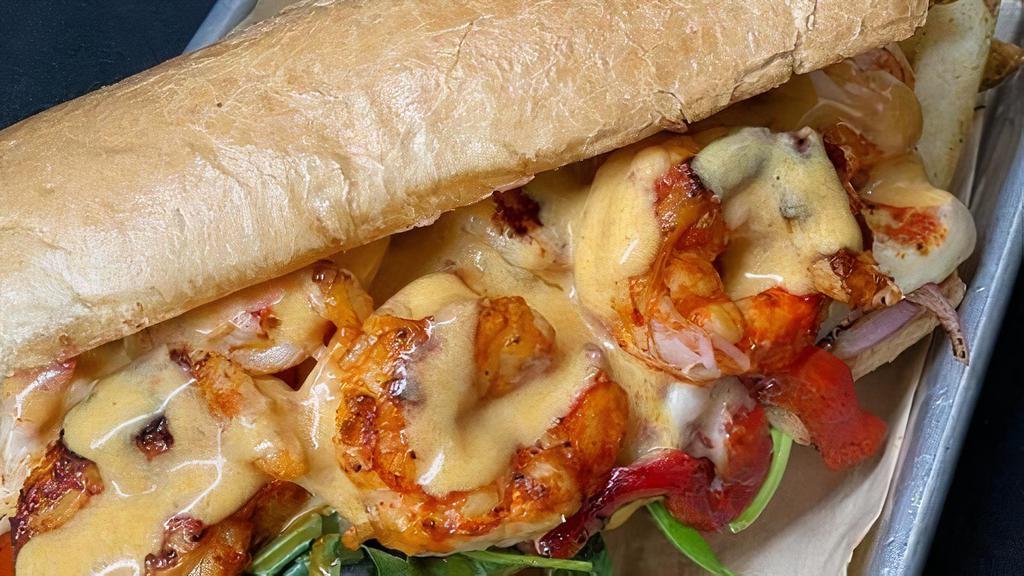 Shrimp Po Boy · French roll, garlic aioli, red onion, roasted red pepper, pepper jack cheese, bronzed Argentina red shrimp, creole cream sauce