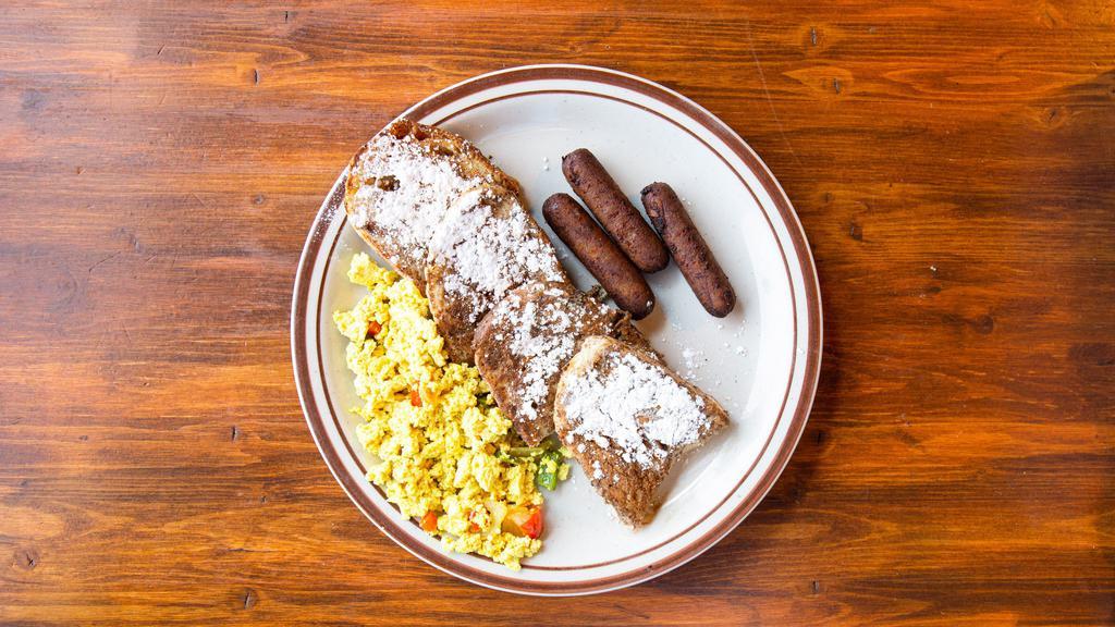 Vegan Union Pacific Style French Toast · Two thick pieces of ciabatta bread sprinkled with powdered sugar and cinnamon. Tofu scramble with onion, green pepper and red pepper, your choice of rice crackling or vegan sausage links.
