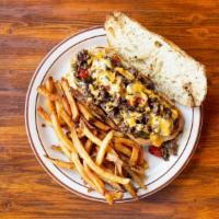 Billy'S Cheese Steak · Chopped Sirloin Steak with Green & Red Peppers, Onion, & house-made Cheese Sauce on a toaste...