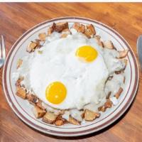 Gravy Train Slinger · Home Fries covered in Feta Cheese & house-made Sausage Gravy, topped with 2 Eggs.
