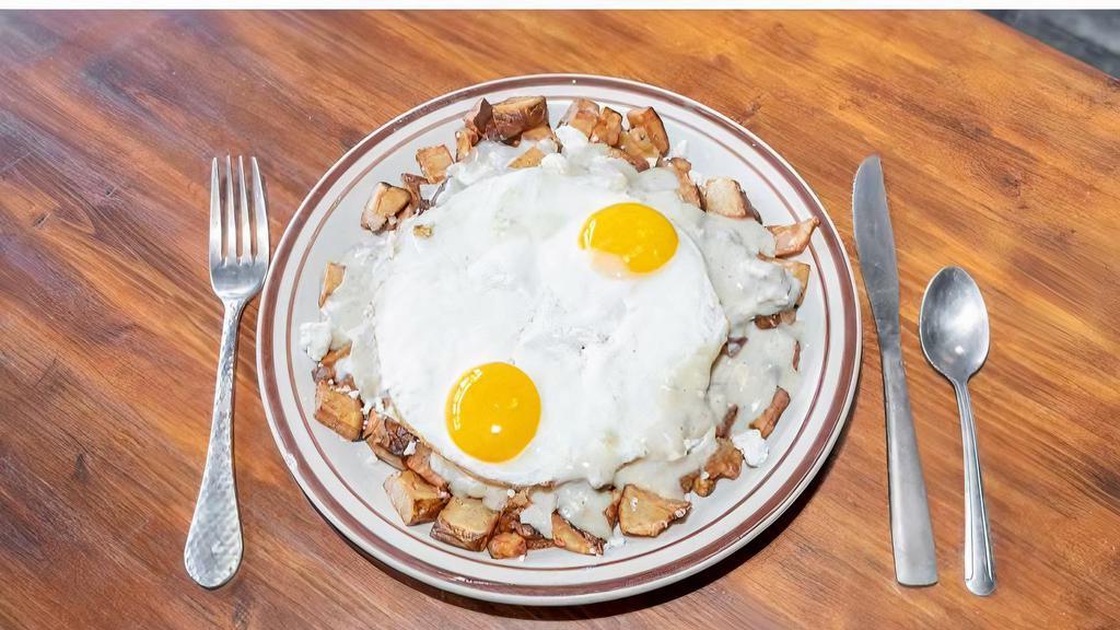 Gravy Train Slinger · Home Fries covered in Feta Cheese & house-made Sausage Gravy, topped with 2 Eggs.