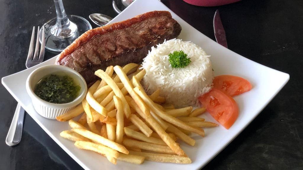 Prime Sirloin Steak / Picanha · Gluten-Free. Ten-ounce prime sirloin steak, grilled to perfection, served with a side of our homemade chimichurri sauce.