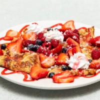 Sweet Berry Crepes (3) · Fresh strawberries, raspberries and blueberries topped with creme anglaise.