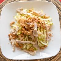 Apple Salad · Shredded apples, red onions, cashew and chicken and tossed in roasted coconut. Gluten-free.