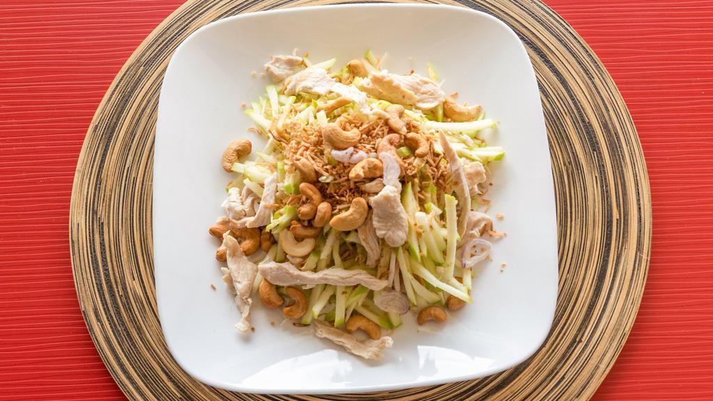 Apple Salad · Shredded apples, red onions, cashew and chicken and tossed in roasted coconut. Gluten-free.