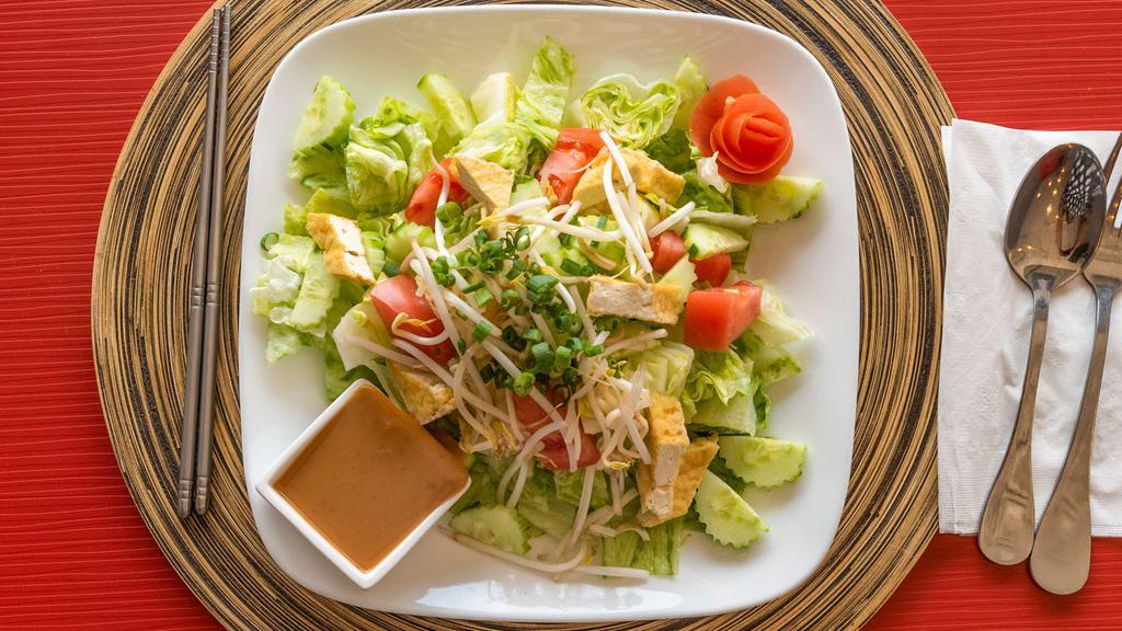 Thai Salad · Lettuce, cucumber, tomatoes, bean sprouts, tofu and green onion topped with light peanut sauce. Gluten free and vegan.
