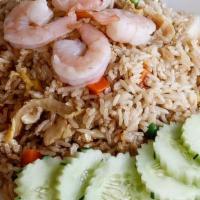 Dinner Kow Pad Fried Rice · Thai style fried rice with egg, onions, peas and carrots.