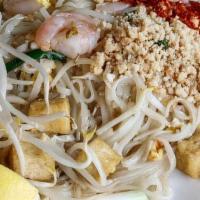 Dinner Pad Thai Noodle · Sauteed rice noodles with eggs, bean sprouts and green onions and garnished with crushed pea...