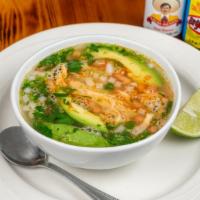 Sopa De Pollo / Chicken & Rice Soup · Chicken soup with generous strips of chicken, onions, tomatoes, avocado and rice in our seas...