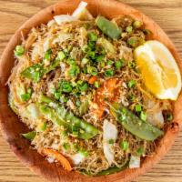 Pancit Bihon · stir fried rice noodles with carrots , celery,  snap peas and cabbage