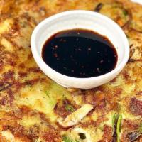 Seafood Pancake · A Korean-style pancake with wild squid, shrimp, mussels, and green onions 

[contains flour ...