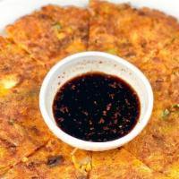Kimchi Pancake · A Korean-style pancake with kimchi and green onions 

[contains flour and eggs]