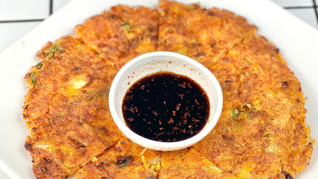Kimchi Pancake · A Korean-style pancake with kimchi and green onions 

[contains flour and eggs]