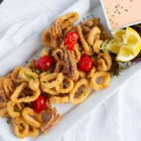 Flash Fried Calamari & Peppadew Peppers · Crisp and golden brown with just the right amount of heat, served with a red pepper aioli sa...