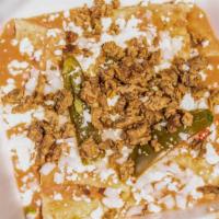 Enfrijoladas (4) · Tortilla de maíz en salsa de frijoles cubierta con queso fresco mexicano, cebolla y jalapeño...