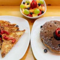 Proper Pancakes · Two stoneground whole wheat pancakes topped with macerated seasonal fresh fruit, served with...