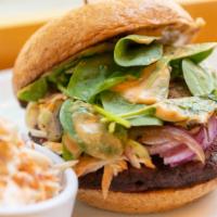 Beet Burger · Our house made organic chickpea and beet patty topped with coleslaw, caramelized onions and ...
