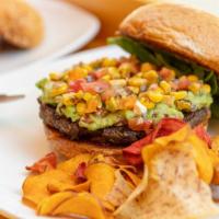 Southwest Black Bean Burger · Our housemade organic black bean patty topped with corn salsa, guacamole, and BBQ sauce serv...
