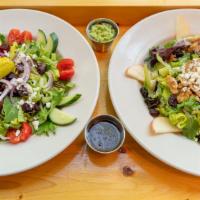 Mediterranean Salad · Romaine and spinach tossed in our housemade creamy avocado balsamic dressing, topped with sl...