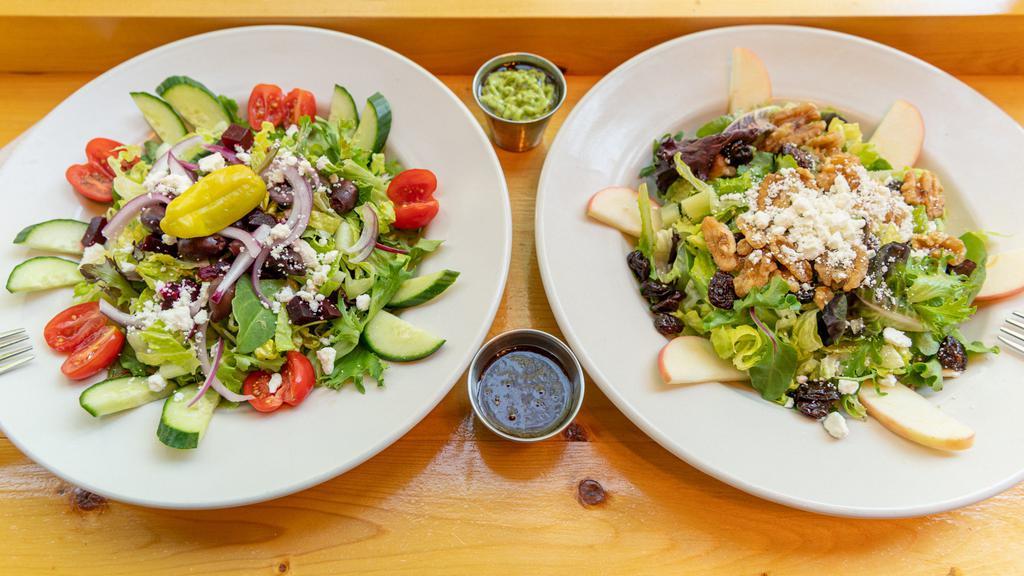 Mediterranean Salad · Romaine and spinach tossed in our housemade creamy avocado balsamic dressing, topped with sliced cucumbers, sliced beets, kalamata olives, red onion, cherry tomatoes, pepperoncini, and feta cheese.
