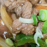 Wokked Pepper Beef · Thinly sliced beef, sweet onions, carrots, mushrooms, bell peppers, green onions, house sauce.