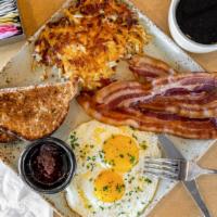 Classic Breakfast · Two eggs with choice of four bacon, two pork sausage links or a ham steak. Served with hashb...
