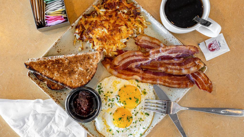Classic Breakfast · Two eggs with choice of four bacon, two pork sausage links or a ham steak. Served with hashbrowns and wheat toast.