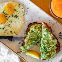 Avocado Toast · Served on whole wheat toast with two eggs on the side.
