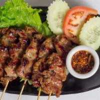 Grilled Pork (Moo Ping) · Marinated pork, skewered and grilled.  Served with home-made spicy sauce.