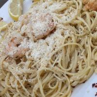 Shrimp Scampi · Succulent Gulf shrimp sautéed in butter, Riesling wine, fresh garlic and secret herbs tossed...