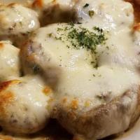 Stuffed Mushrooms · Sautéed mushroom caps filled with cream cheese, bacon bits, chives, and seasonings. Topped w...