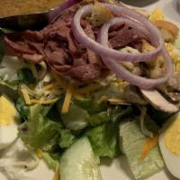 Wurst Salad · Marinated German luncheon meats atop mixed greens garnished with vegetables, assorted cheese...