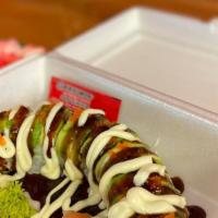 Crab Stick Roll · Crab stick, avocado, and cucumber, topped with spicy mayo and sushi sauce, and sprinkled wit...