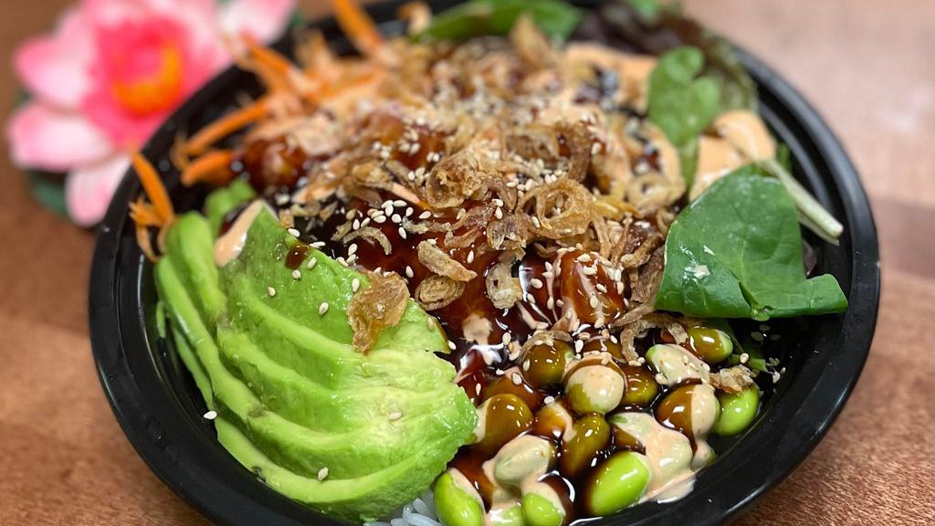 Tuna Poke Bowl (Raw) · Sushi rice (raw), mixed green, carrot, avocado, and edamame, topped with spicy mayo and sushi sauce, and sprinkled with crispy onion and sesame seeds.