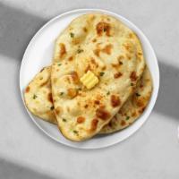Cheese Naan · All-purpose flour, American cheese, milk, water, salt, baking powder, and butter added after...