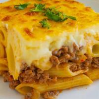 New! Macarona Bechamel · Pasta layered with a spiced beef mixture, topped with a creamy bechamel sauce and baked unti...