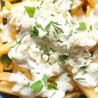 Greek French Fries · Seasoned French fries topped with our house sauce, Feta cheese, olive oil, Greek herbs and s...