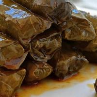 Stuffed Grape Leaves (Homemade) · Vine grape leaves stuffed with rice and a blend of Mediterranean herbs and spices atop a bed...